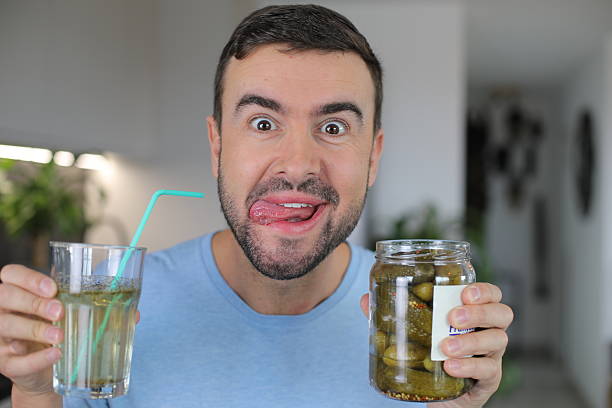 Person choosing between snacks and a glass of water